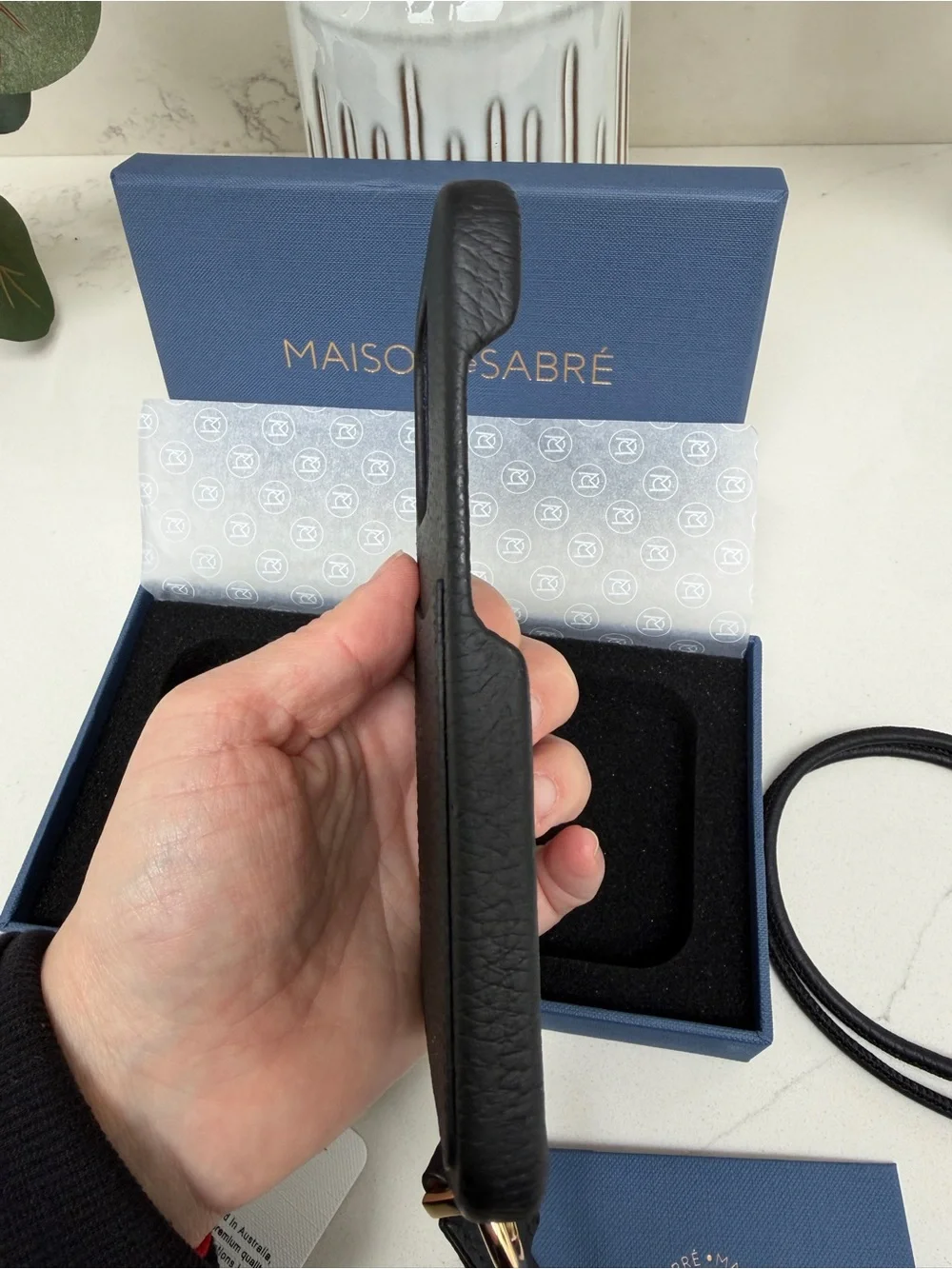 Maison de Sabre Sling Phone Case iPhone 14 Pro in Black Caviar and Gold Hardware